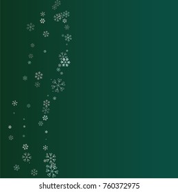 Christmas background with random scatter falling silver snowflakes isolated on a dark green gradient background