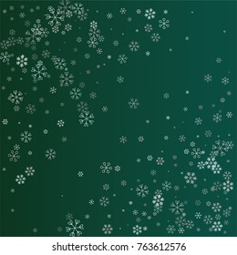 Christmas background with random scatter falling silver snowflakes isolated on a dark green gradient background