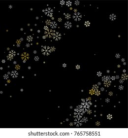 Christmas background with random scatter falling silver and gold snowflakes isolated on black.