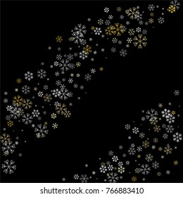 Christmas background with random scatter falling silver and gold snowflakes isolated on black.