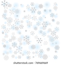 Christmas background with random scatter falling silver snowflakes and blue blurred dots isolated on white.