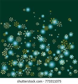Christmas background with random scatter falling golden snowflakes and blue blurred lights on a dark green background.