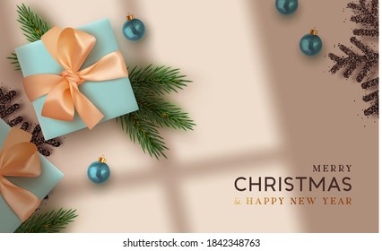 Christmas background. Realistic design with 3d Xmas decoration objects, gift box, fir branches, bauble balls, black shiny snowflake. Flatlay top view composition. Greeting card, banner, poster.