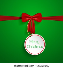 Christmas background with red bow and label