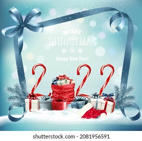 Christmas background with a red sack full presents, candy cone and santa hat. Vector.