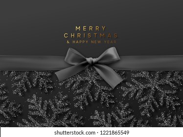 Christmas background with shining black snowflakes and a black ribbon with bow. Vector illustration