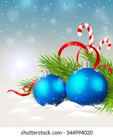 Christmas background with shining blue decorations and candy cane