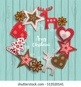 Christmas background, small scandinavian styled red decorations lying on blue wooden desk, inspired by flat lay style, with text Merry christmas, framed by abstract leaf wreath, vector illustration