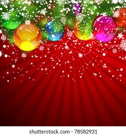 Christmas background with snow-covered Christmas tree decorated with glass balls.