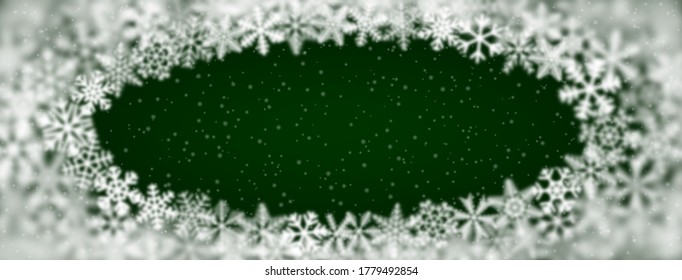 Christmas background of snowflakes of different shape, blur and transparency, arranged in a ellipse, on green background