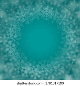 Fondo navideño de copos de nieve de diferente forma, borrosidad y transparencia, dispuestos en círculo, sobre fondo turquesa