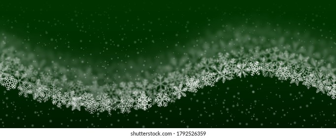 Christmas background of snowflakes of different shape, blur and transparency, wave shaped, on green background