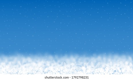 Christmas background of snowflakes of different shape, blur and transparency, located bottom, on light blue background