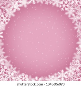 Christmas background of snowflakes of different shape, blur and transparency, arranged in a circle, on pink background