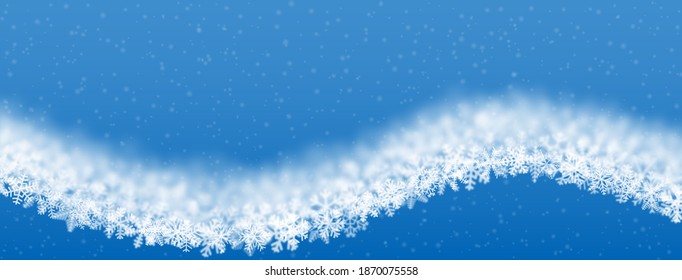 Christmas background of snowflakes of different shape, blur and transparency, wave shaped, on light blue background