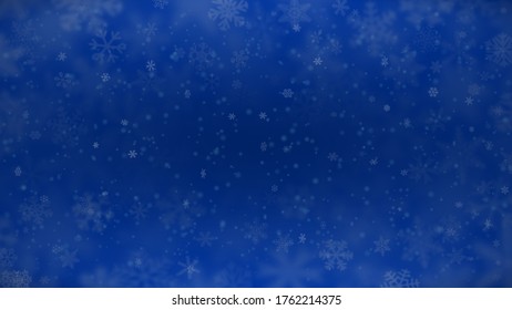 Christmas background of snowflakes of different shapes, sizes, blur and transparency in blue colors