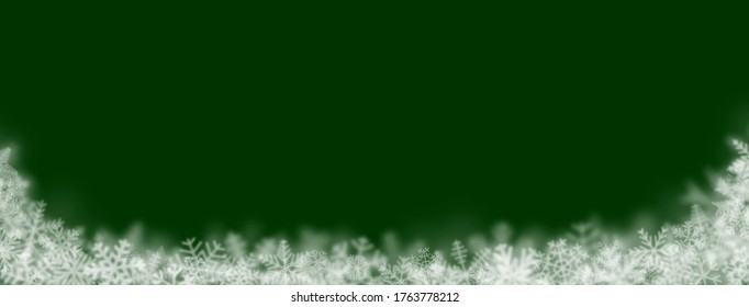 Christmas background of snowflakes of different shapes, sizes, blur and transparency on green background