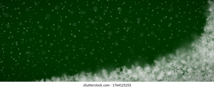 Christmas background of snowflakes of different shapes, sizes, blur and transparency on green background