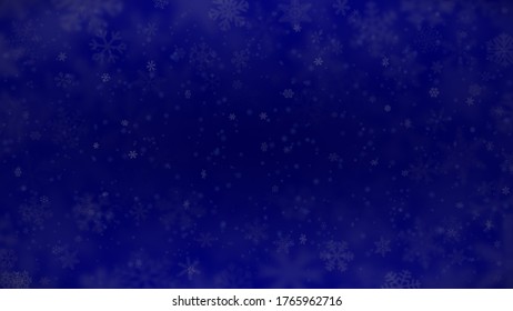 Christmas background of snowflakes of different shapes, sizes, blur and transparency in blue colors