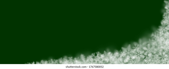 Christmas background of snowflakes of different shapes, sizes, blur and transparency on green background