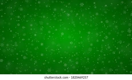 Christmas background of snowflakes of different shapes, sizes and transparency in green colors