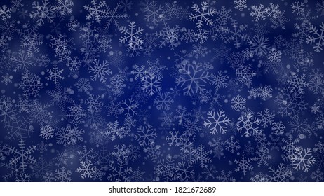 Christmas background of snowflakes of different shapes, sizes and transparency in blue colors