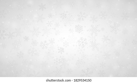 Christmas background of snowflakes of different shapes, sizes and transparency in gray and white colors