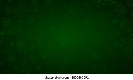 Christmas background of snowflakes of different shapes, sizes and transparency in dark green colors