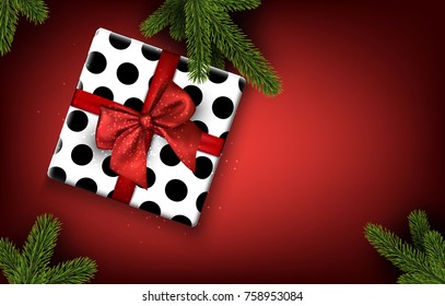Christmas background with spruce branches and gift box. Vector top view illustration.