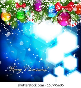 Christmas background with Christmas tree branch decorated with glass balls.