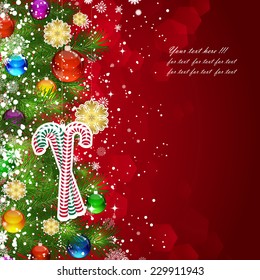 Christmas background with Christmas tree branches decorated with glass balls and toys.