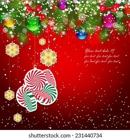 Christmas background with Christmas tree branches decorated with glass balls and toys.