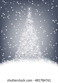 Christmas background. Christmas tree made of fluffy snowflakes on soft blue background with falling snow.