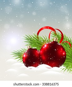 Christmas background with two shining red decorations in snow