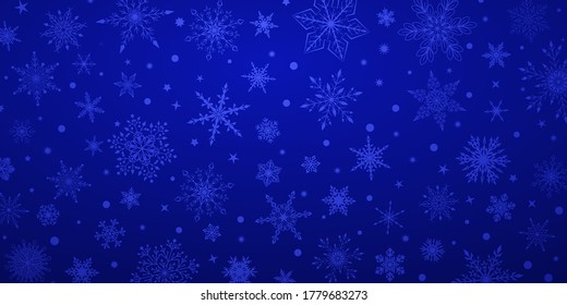 Fondo de Navidad con varios complejos copos de nieve grandes y pequeños, en colores azules