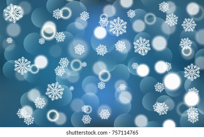 Christmas background with white blurred and clear snowflakes