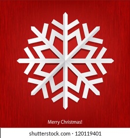 Christmas background with white paper snowflake.