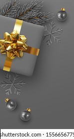 Christmas background. Xmas design realistic gift boxes with golden lush bow, pine branches, fir spruce branch, decorative balls. 3d dark gray snowflake. Flat lay, top view. New year's composition