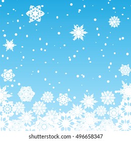 Christmas background.White snowflakes on blue background.Background for New Year's greetings.Winter abstraction