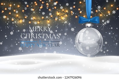 Christmas ball with blue bow, snowy night woodland landscape with falling snow, light garland, snowflakes for winter and new year holidays. Xmas winter background.