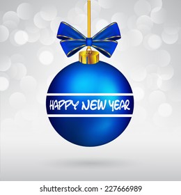 Christmas ball with bow and Happy New Year text on sparkling background.