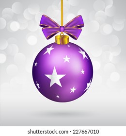 Christmas ball with bow and star shape on sparkling background.