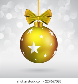 Christmas ball with bow and star shape on sparkling background.