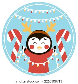 Christmas ball with cute penguin character holding candy cane