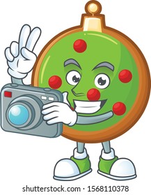 Christmas ball as a professional photographer with a camera.