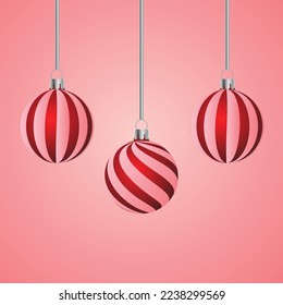 Christmas ball with red and white stripes on a pink gradient background
