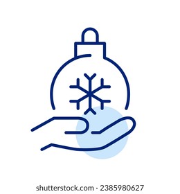 Christmas ball with snowflake in hand. Winter holidays symbol. Pixel perfect icon