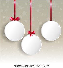 Christmas balls hanging on red ribbon