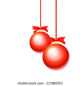 Christmas balls hanging with ribbons on white background