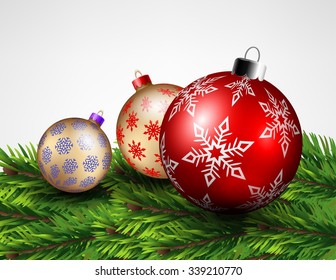 Christmas balls on a pile of pine leaves